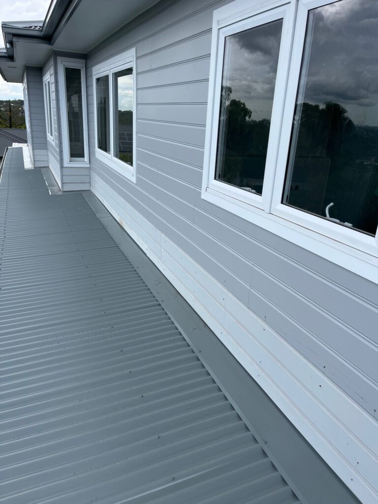 Weatherboard exterior with a side walkway